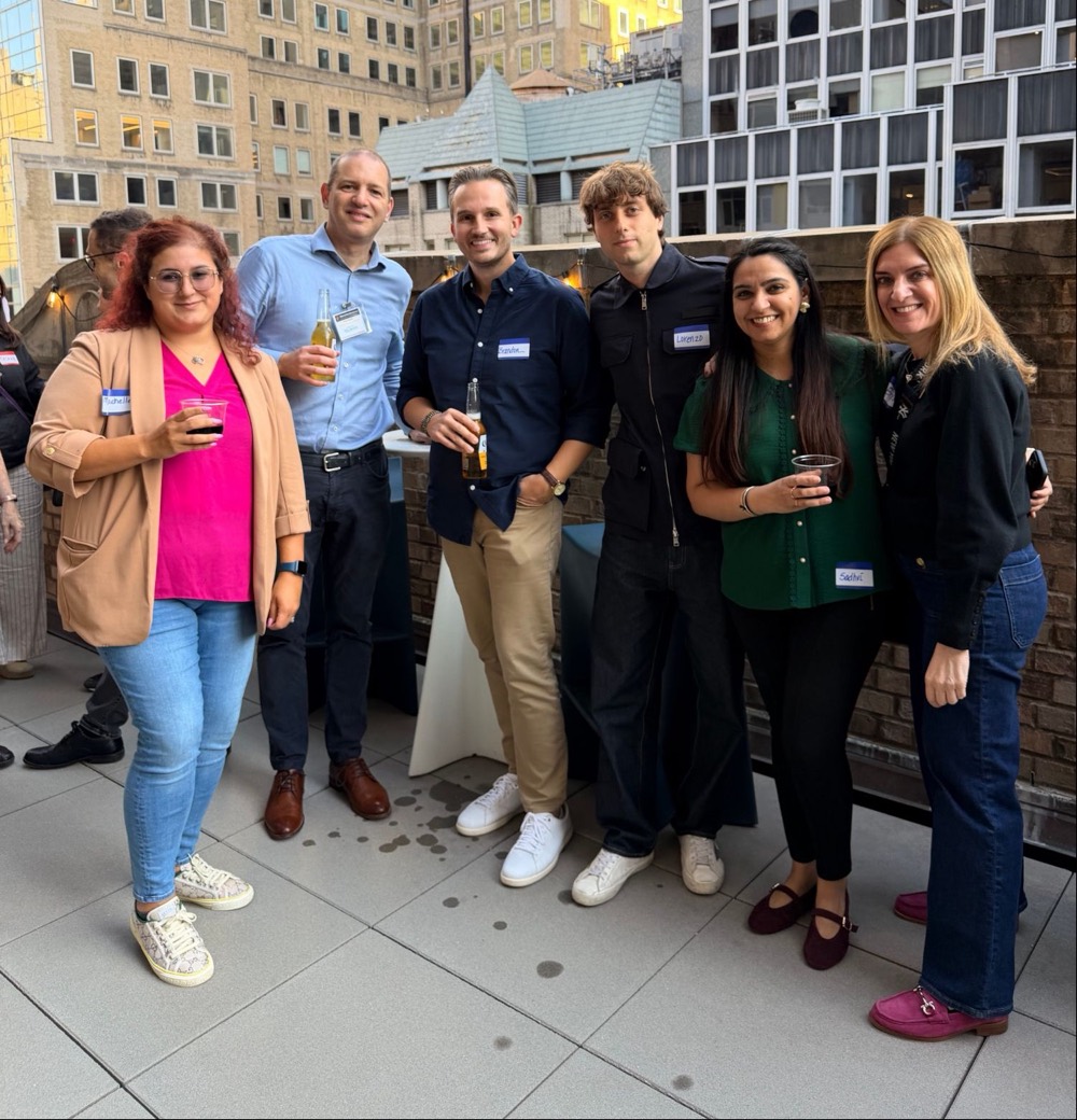 Part of the Demure team together on a rooftop